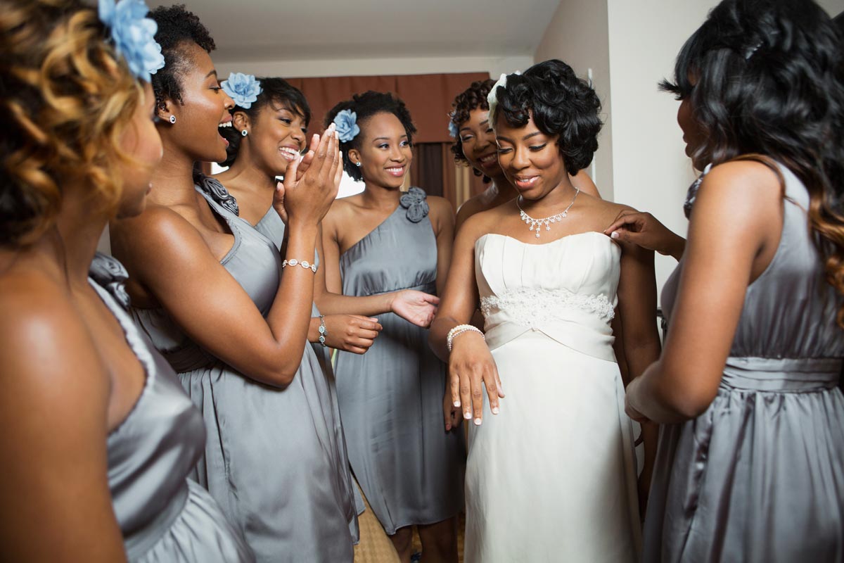 Beautiful Bride being celebrated by her beautiful bridesmaids wearing matching dresses