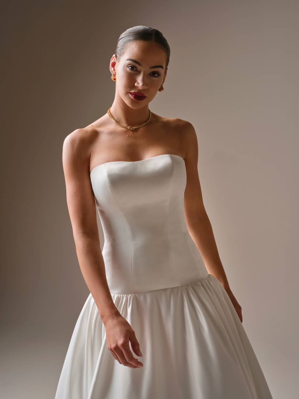 Woman wearing a drop waist wedding dress